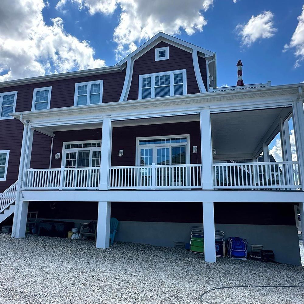 A large house with a large porch and stairs