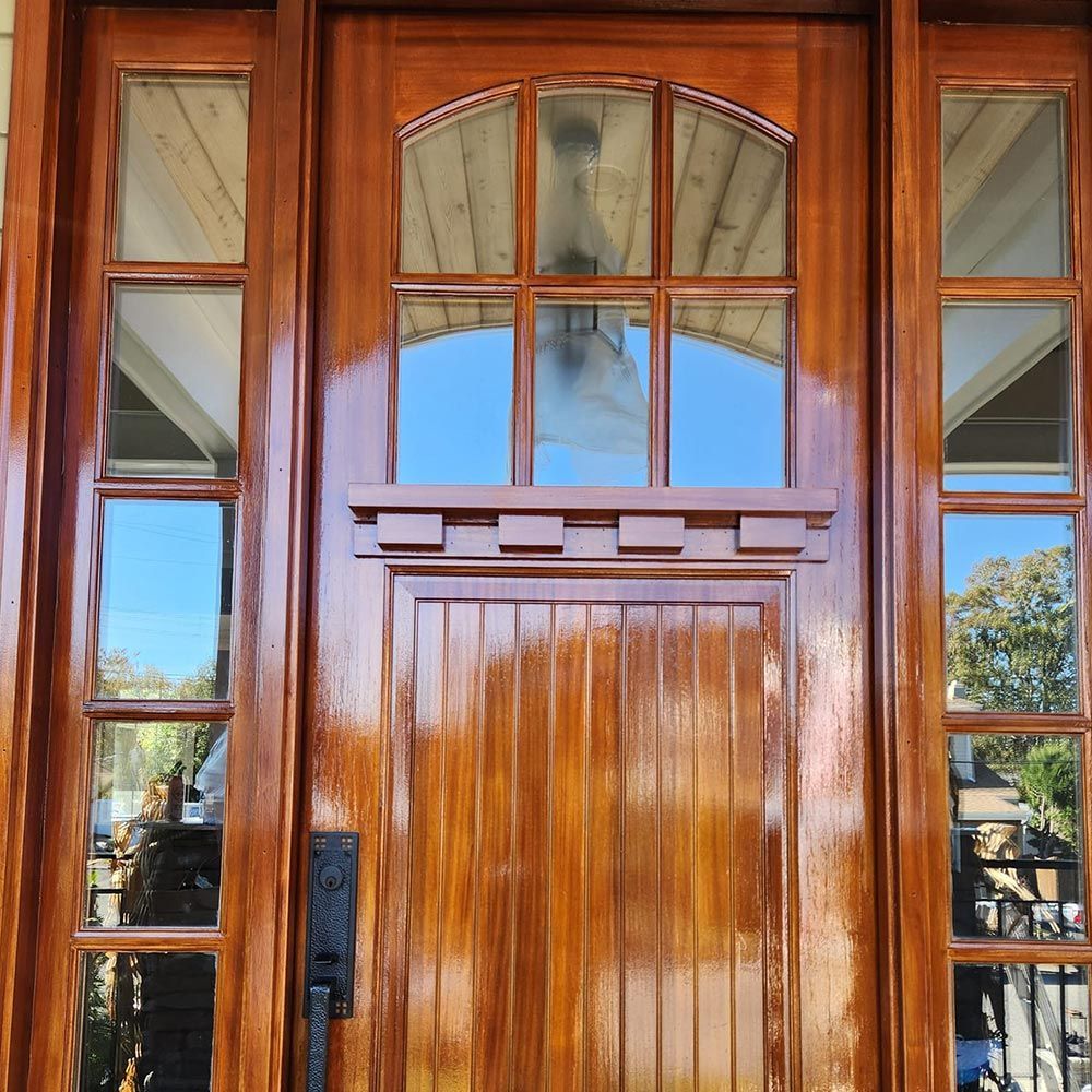 A close up of a wooden door with a lot of windows