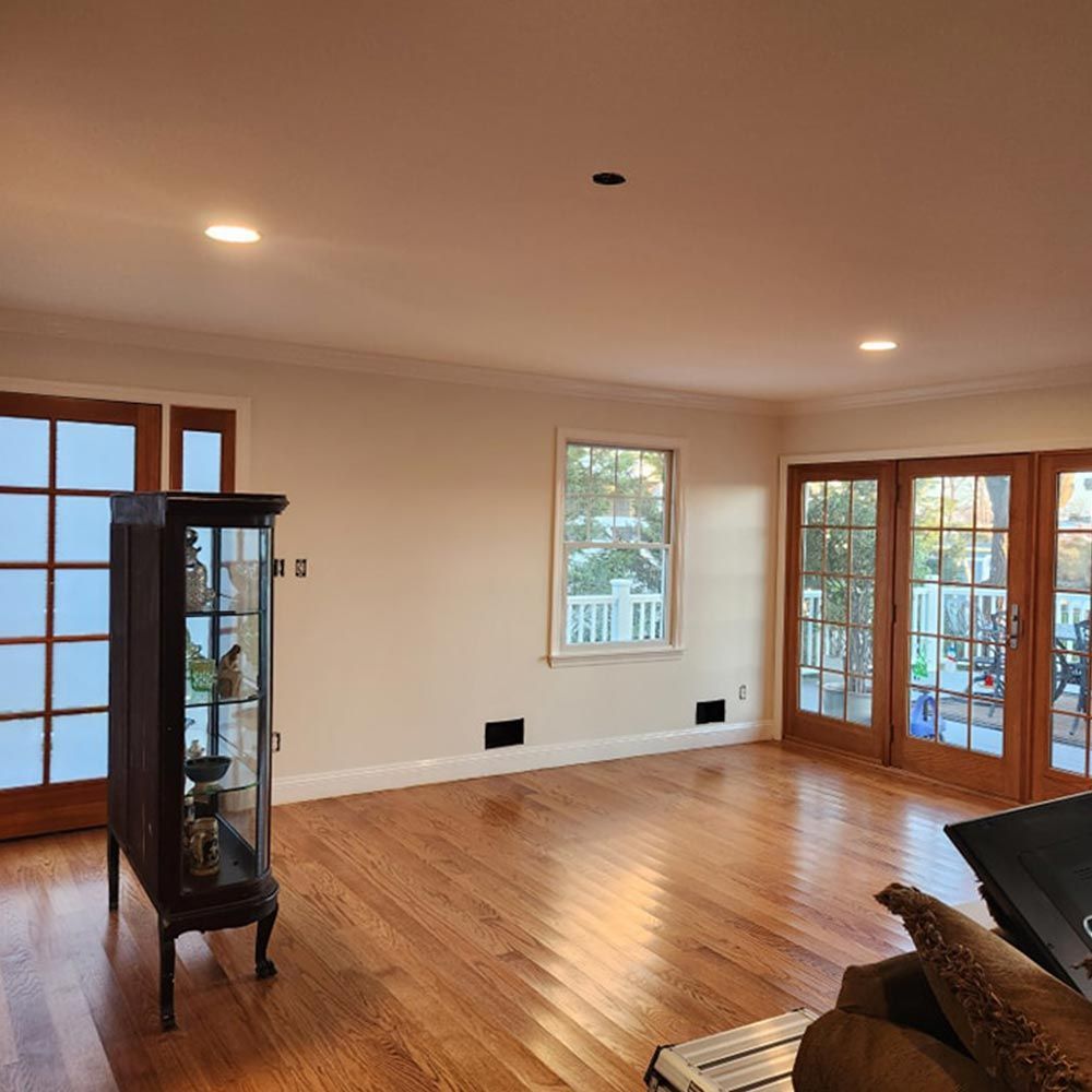 A living room with hardwood floors and french doors