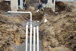 Workers replacing sewer pipes
