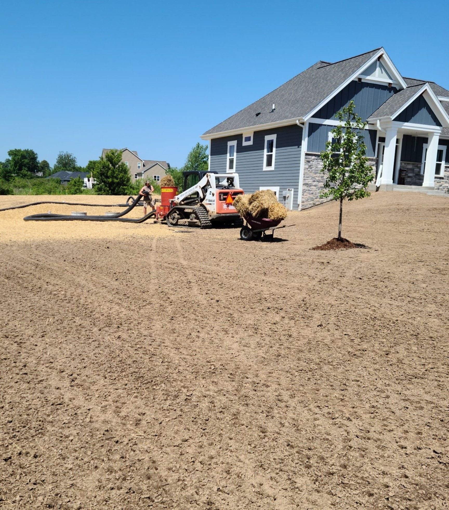 A house with a lot of dirt in front of it