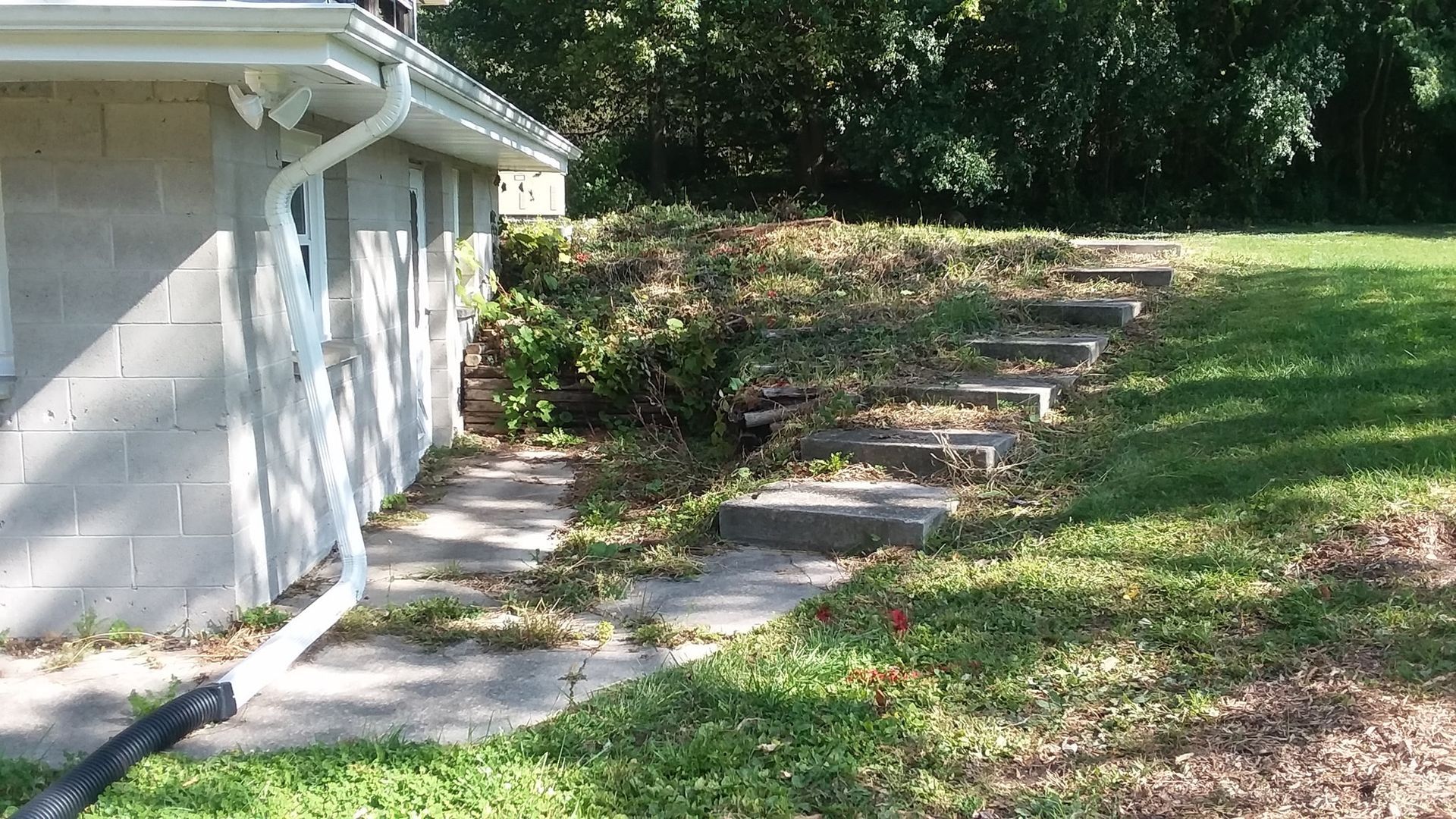 The side of a house with stairs leading up to it