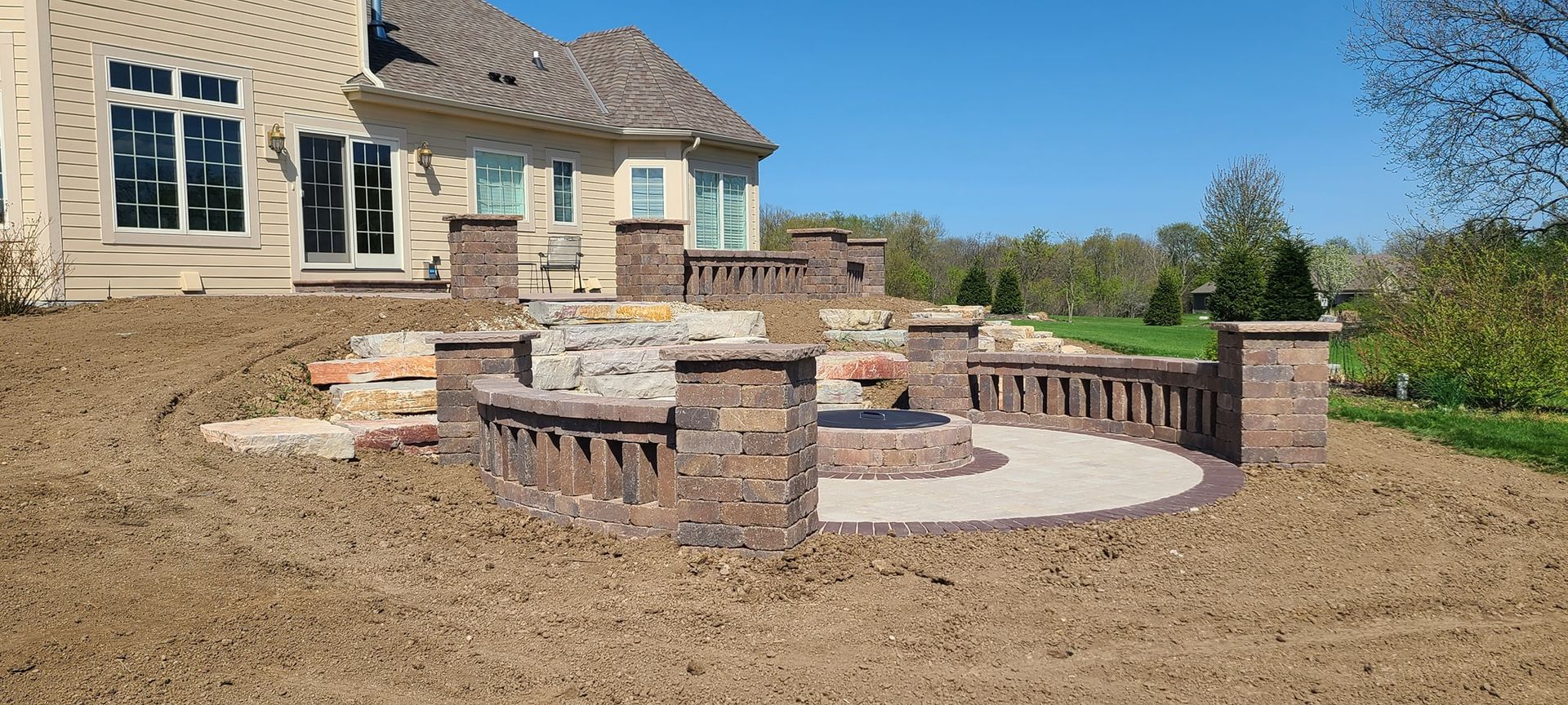A large house with a patio in front of it