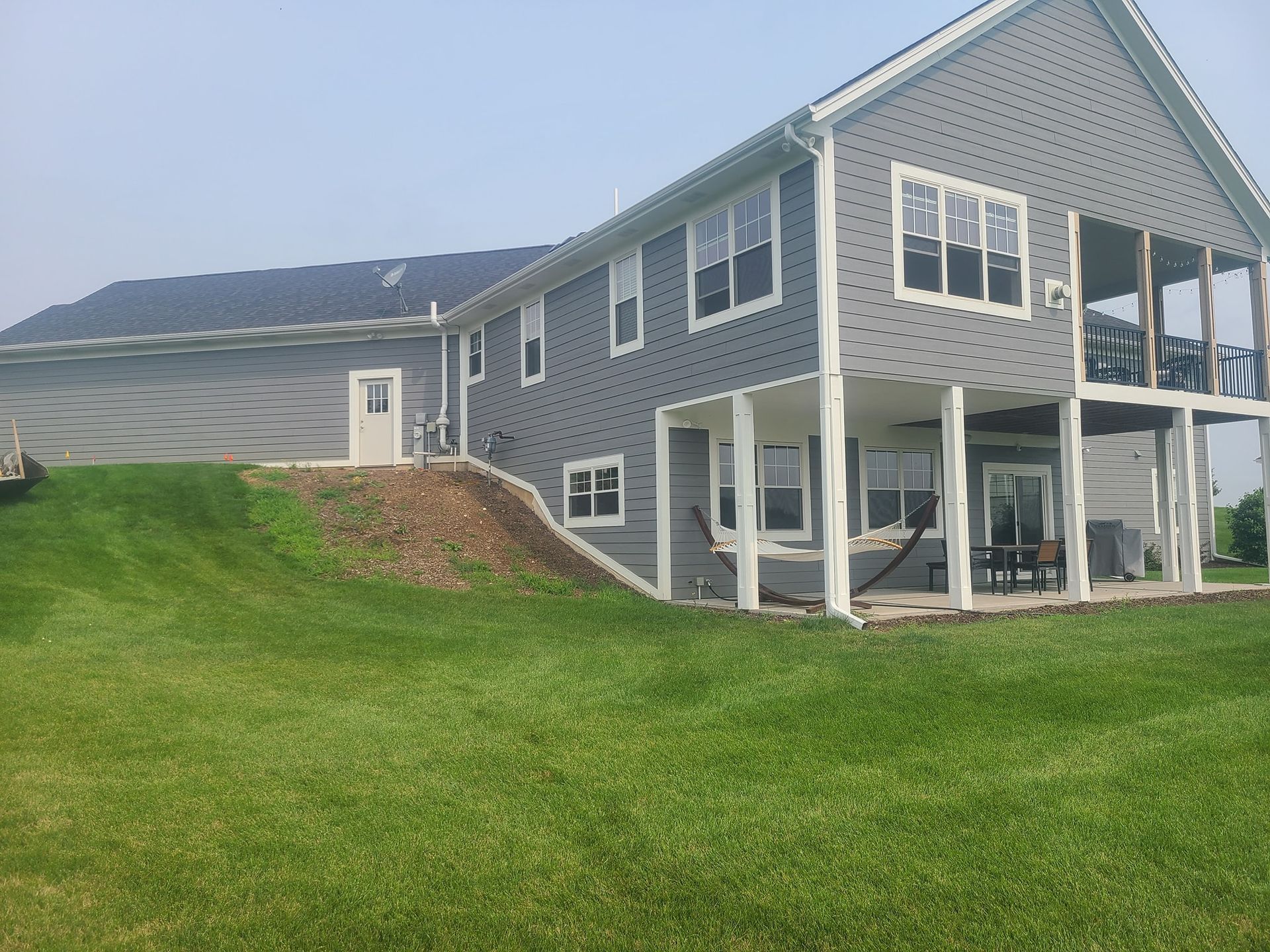 A large house with a large lawn in front of it