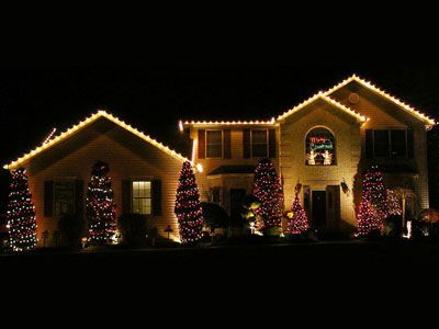 House decorated with Christmas lights at night