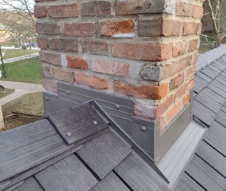 Cedar shingle / Enviorshake roof on George Newcom house – After