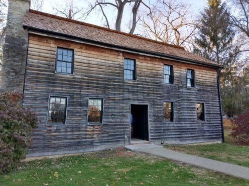 Newcom tavern with a new cedar shake roof and restored windows