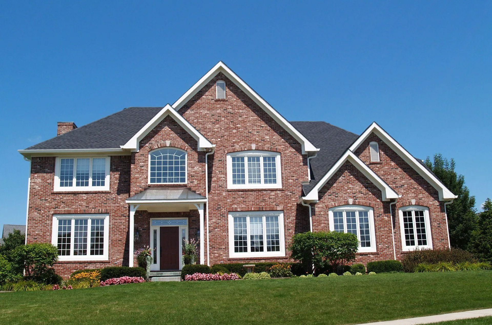 A large brick house with a lot of windows