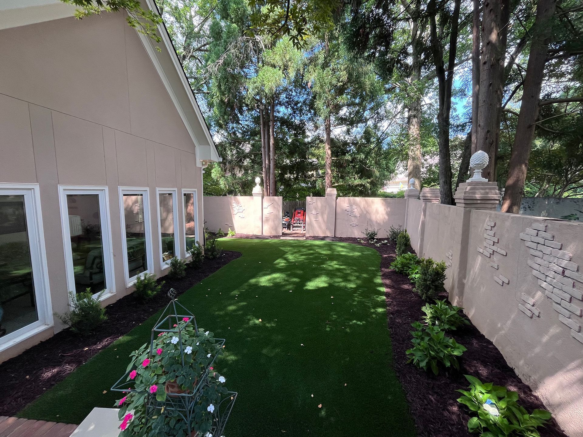A house with a large lawn in front of it