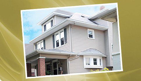 Vinyl siding with gutters and downspouts