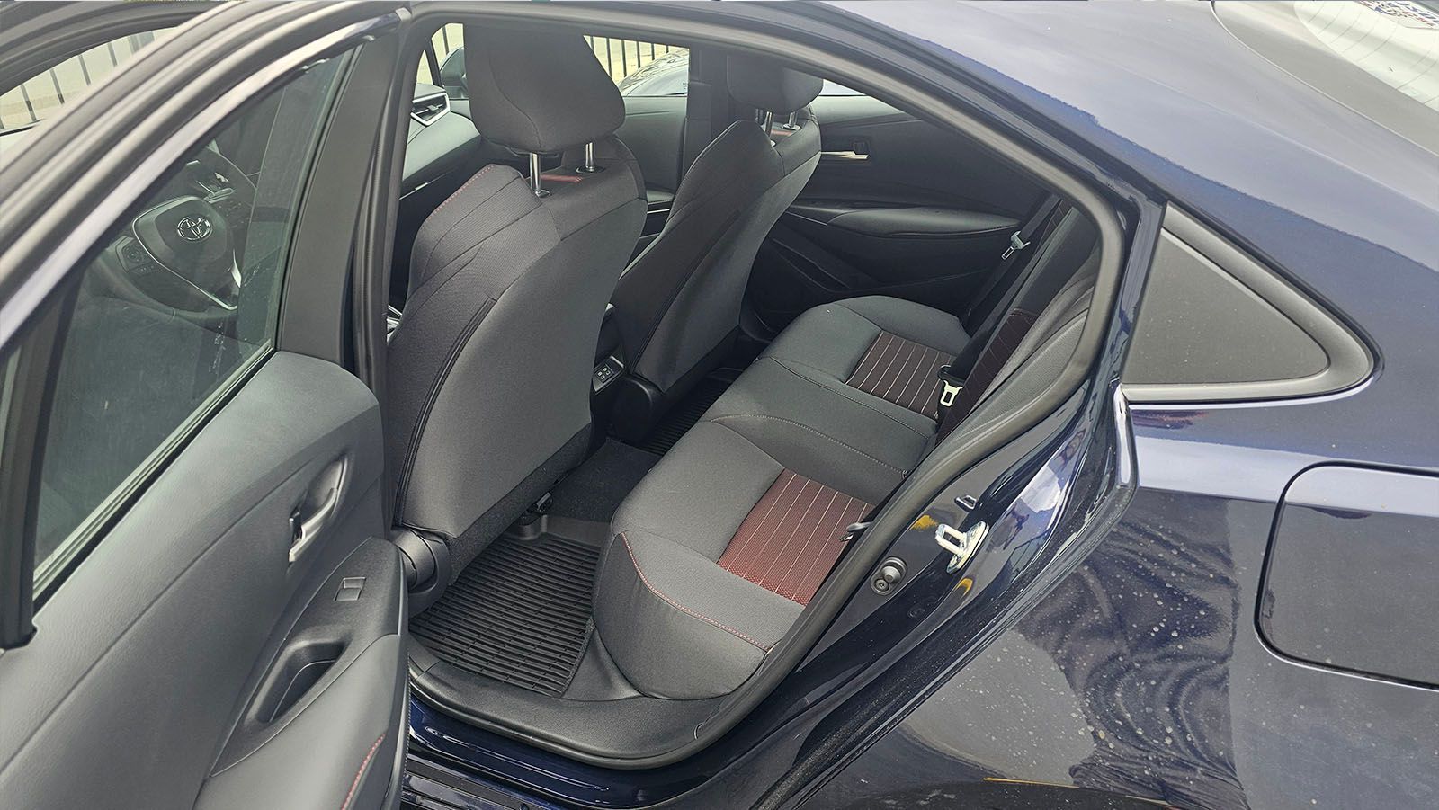 Interior view of a car with open back door