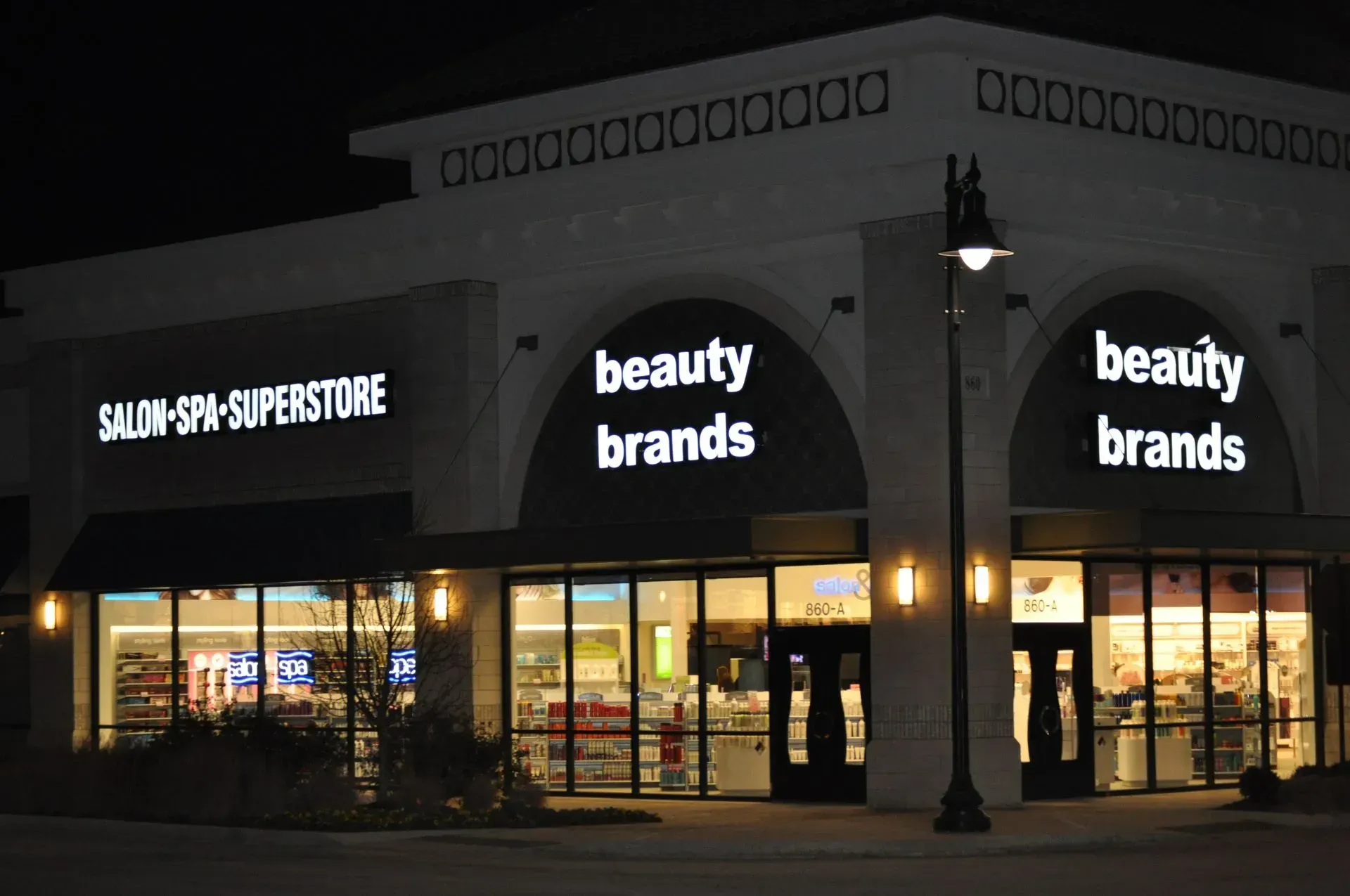 Beauty Brands store lit up at night with 