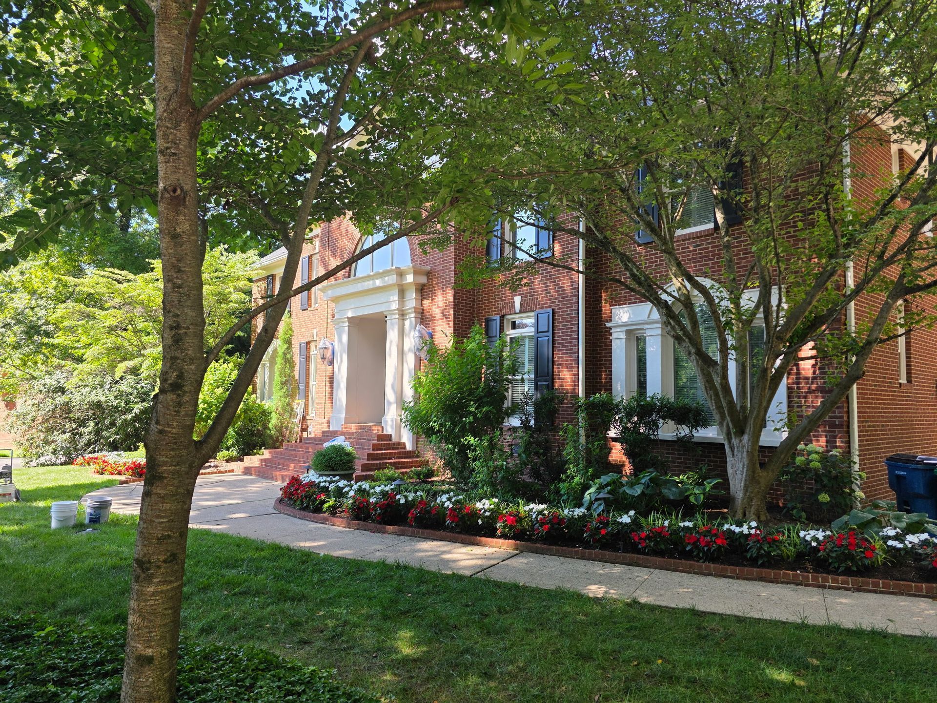 Red brick house with white trim