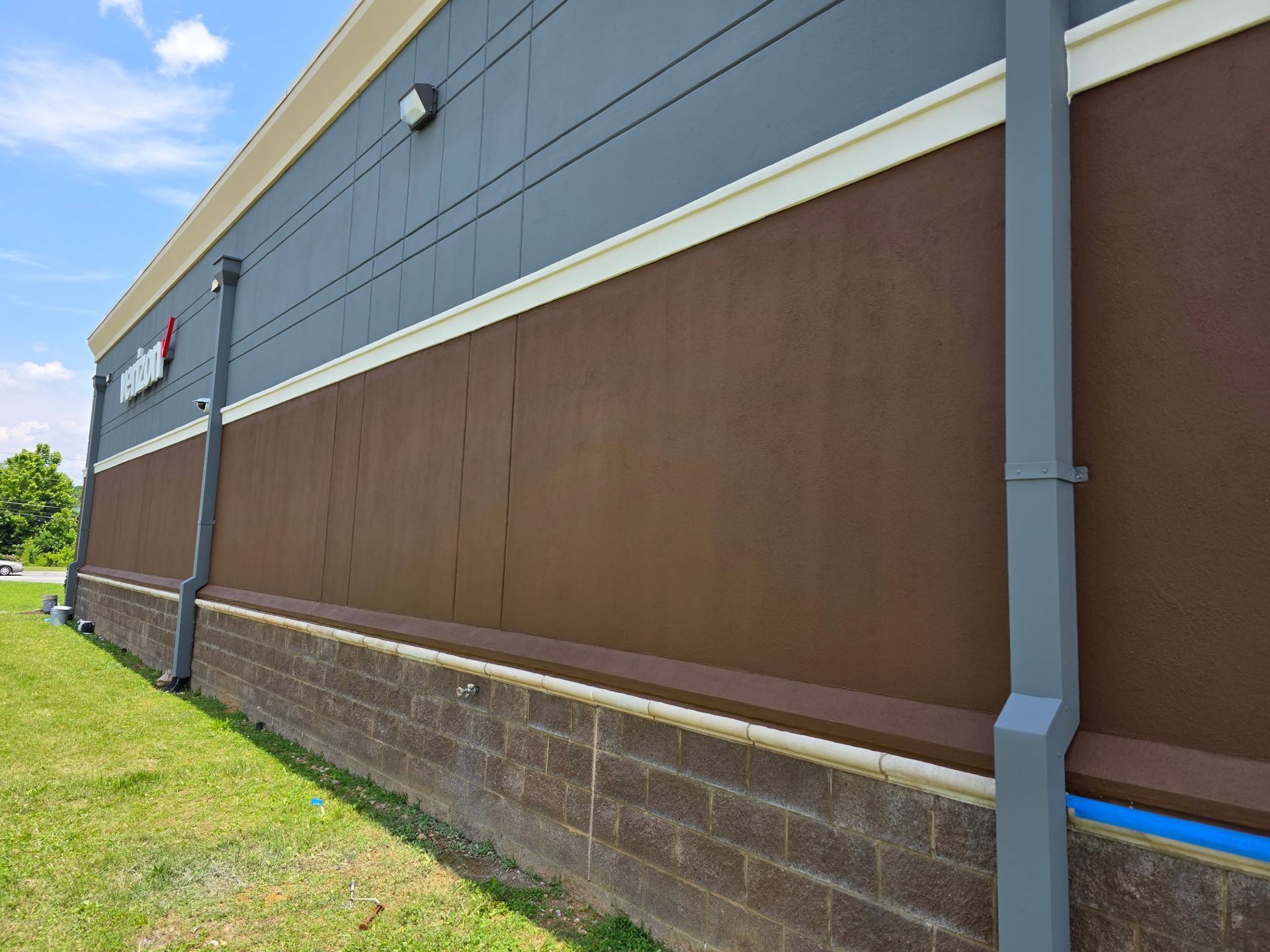 Exterior of a building with brown and gray siding