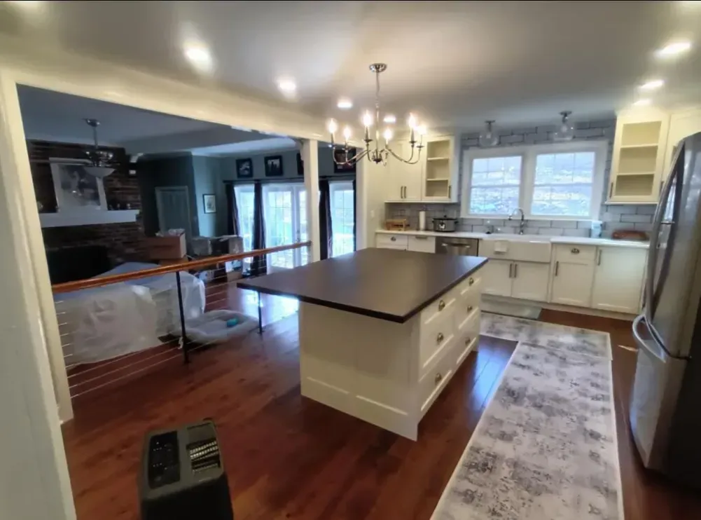 A kitchen with a large island in the middle of it