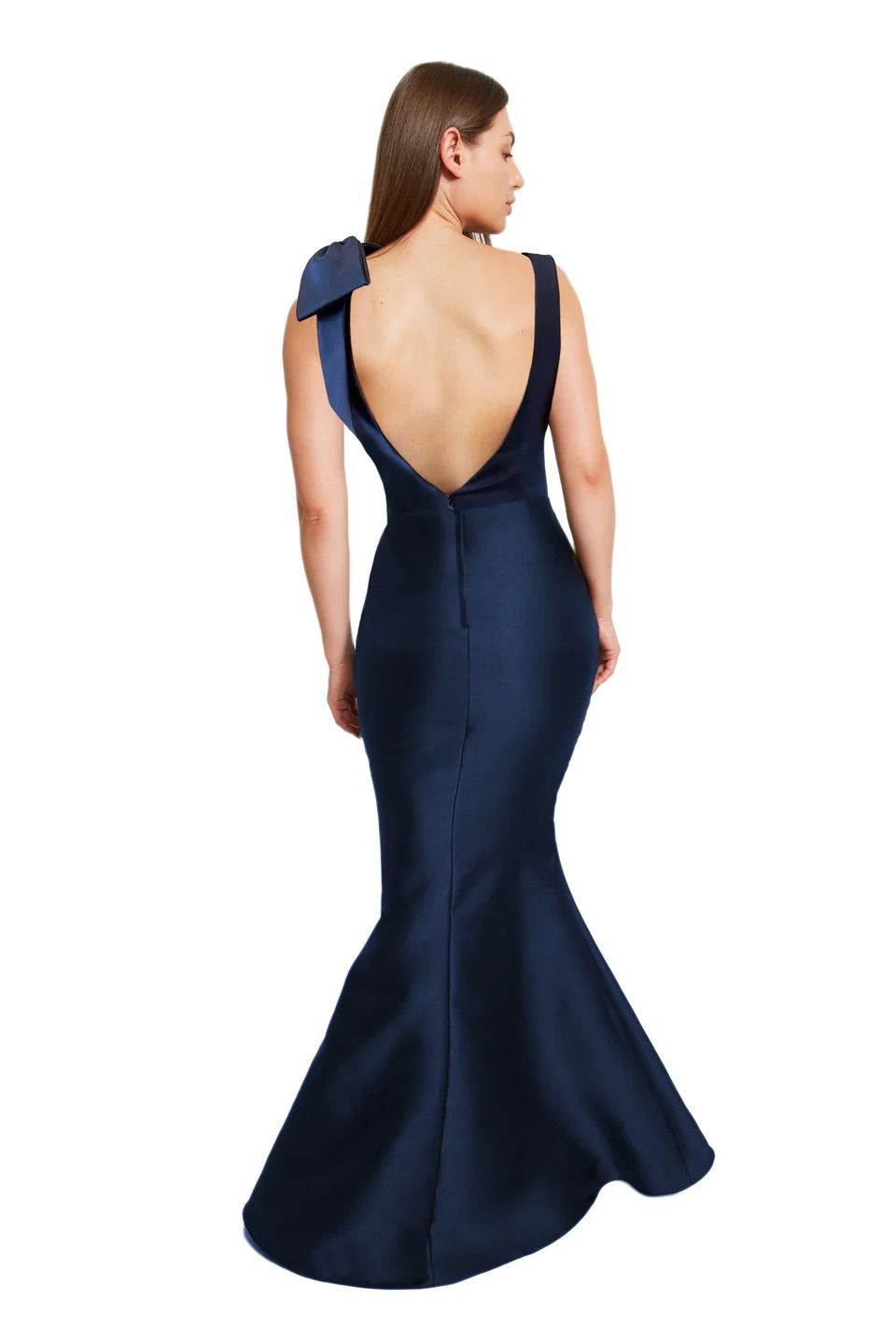 The back of a woman wearing a blue dress with a bow on the shoulder.