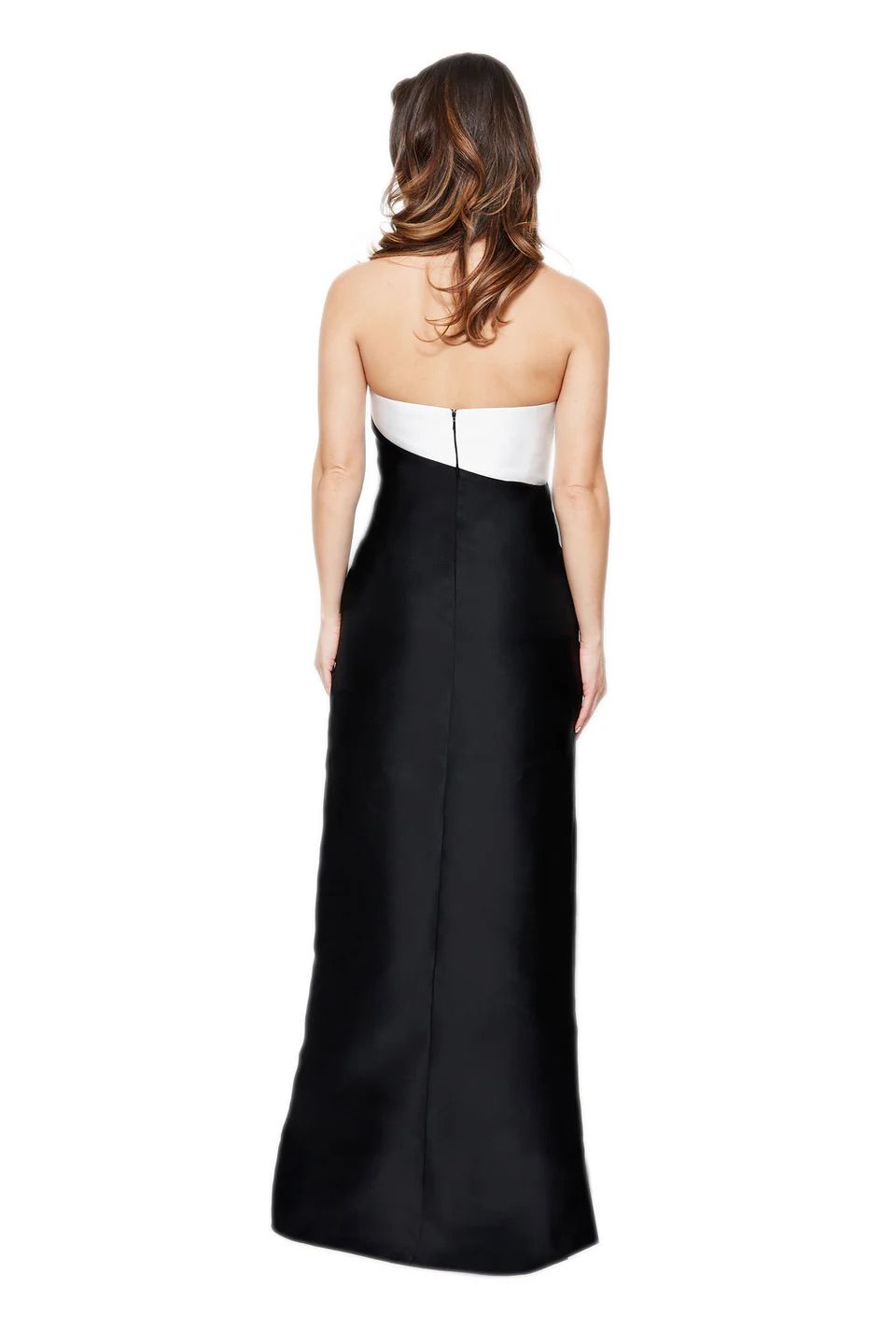 A woman is shown from the back, wearing a black and white strapless dress.