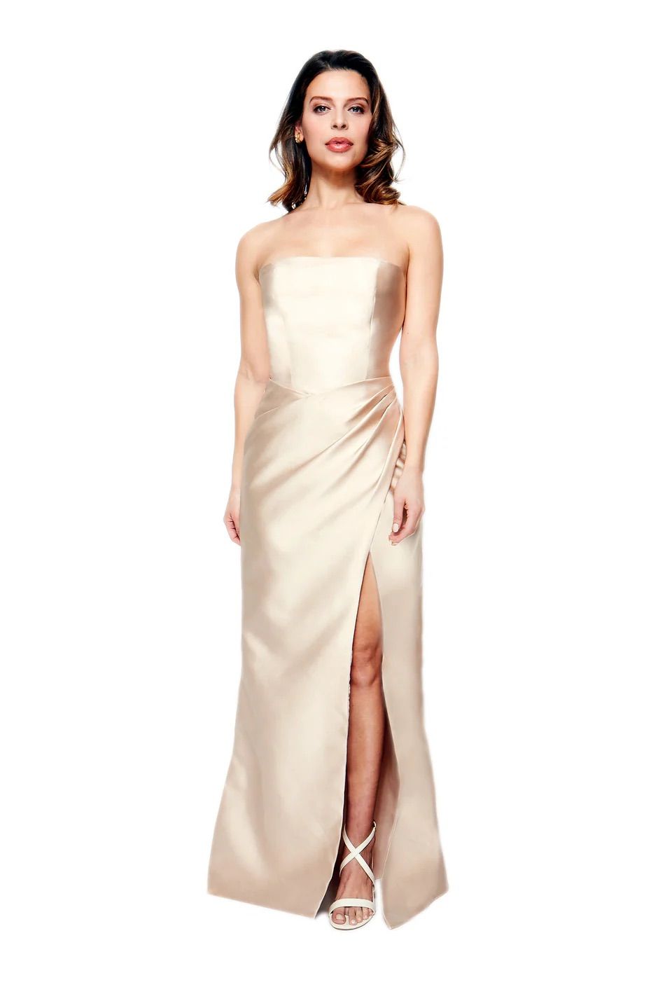 A woman is wearing a strapless dress with a high slit.
