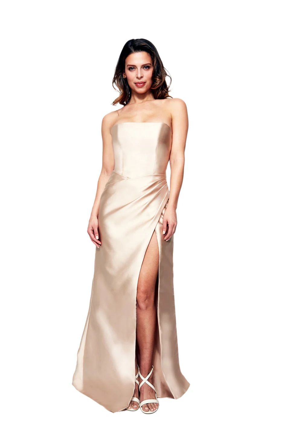 A woman is wearing a strapless dress with a high slit.