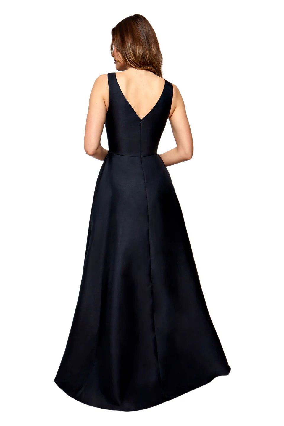A woman is shown from the back, wearing a black dress.