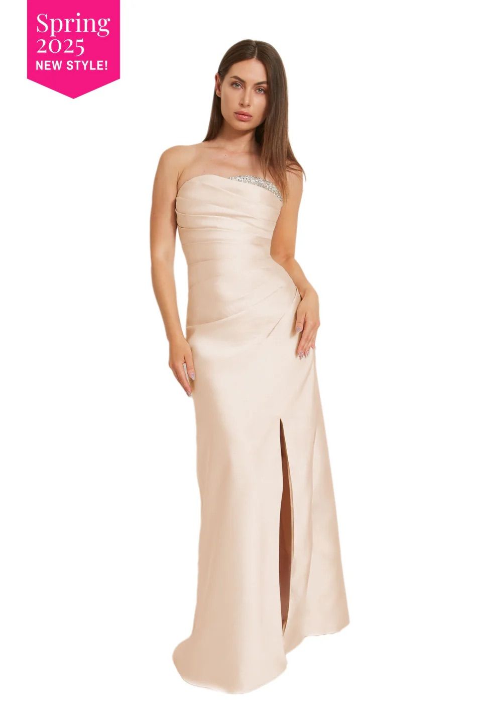 A woman is wearing a strapless dress with a high slit.