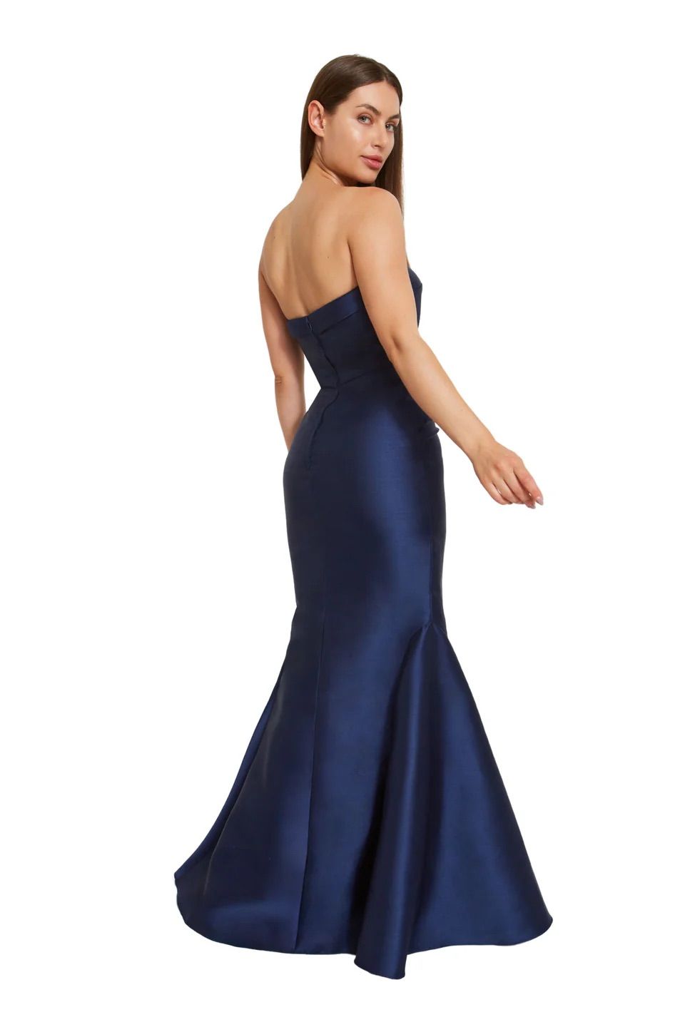A woman is shown from the back, wearing a long blue dress.