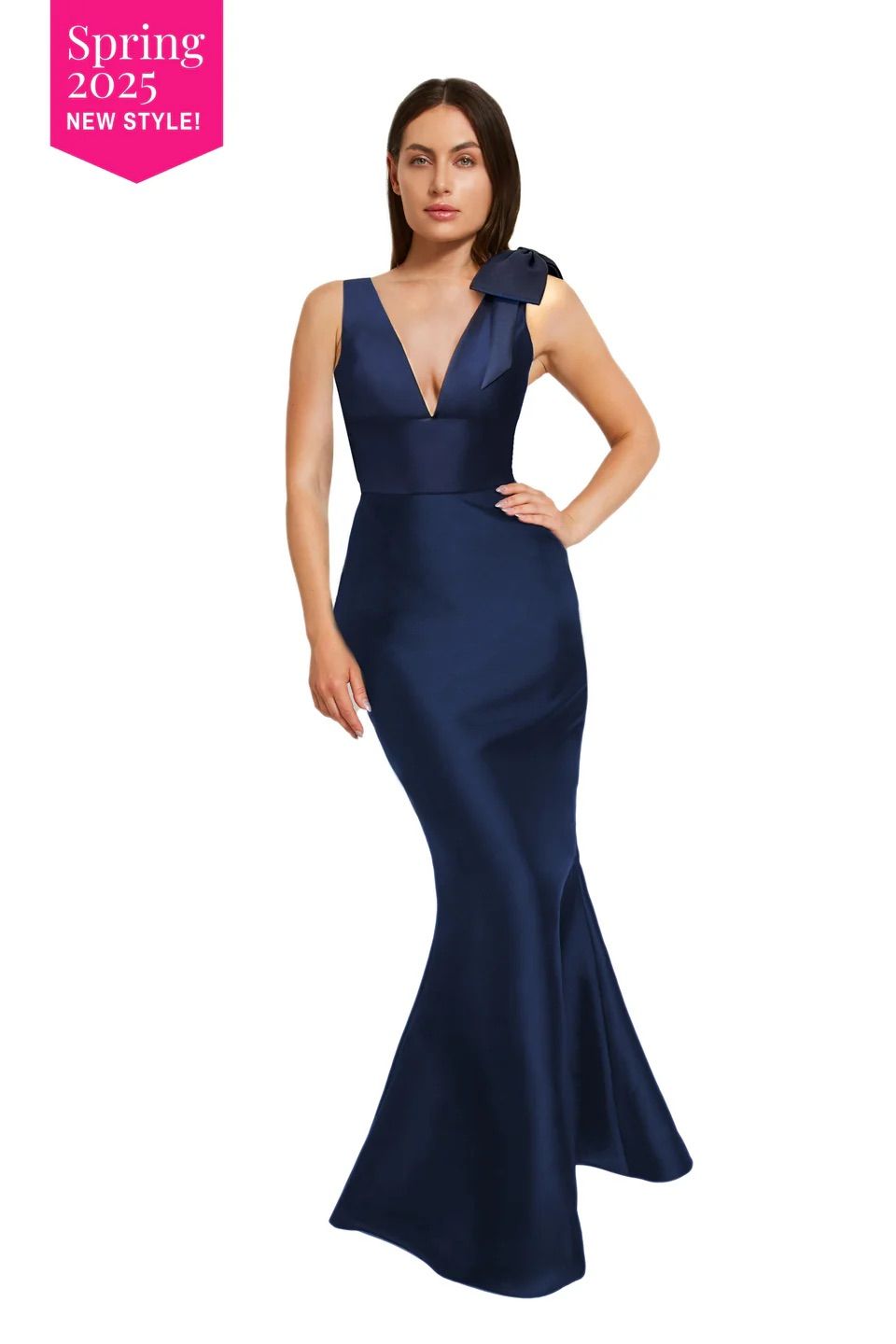 A woman is wearing a long blue dress with a plunging neckline.