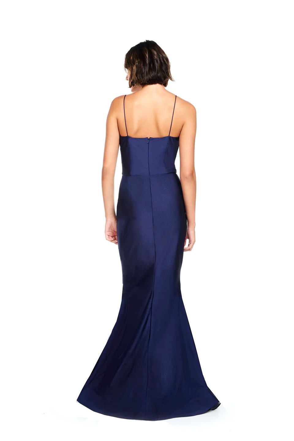 The back of a woman wearing a long blue dress