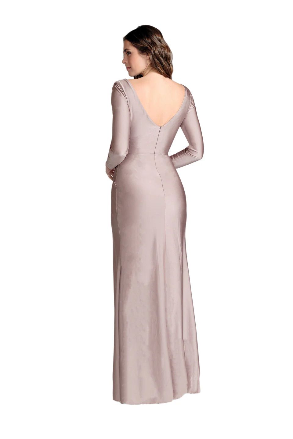 A woman is wearing a long pink dress with long sleeves and a v-neck.