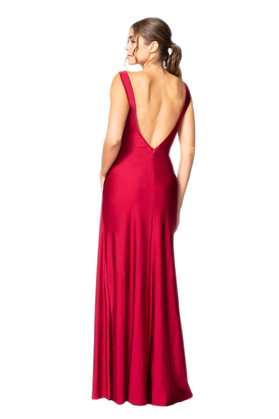 A woman is wearing a red dress with a v-neck and a low back.