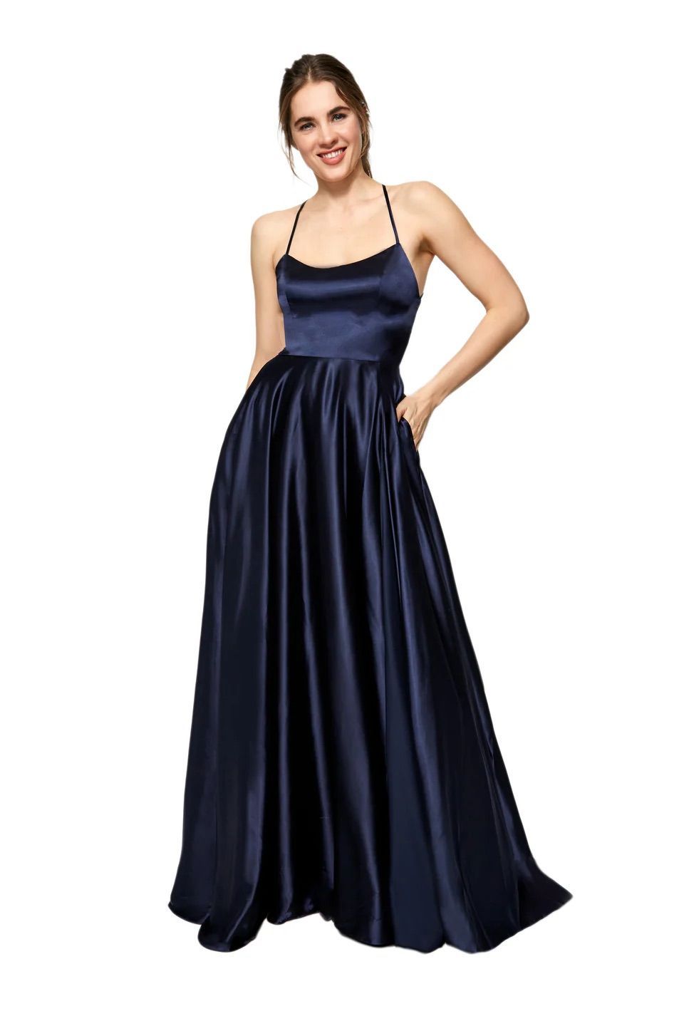 A woman is wearing a long blue satin dress with pockets.