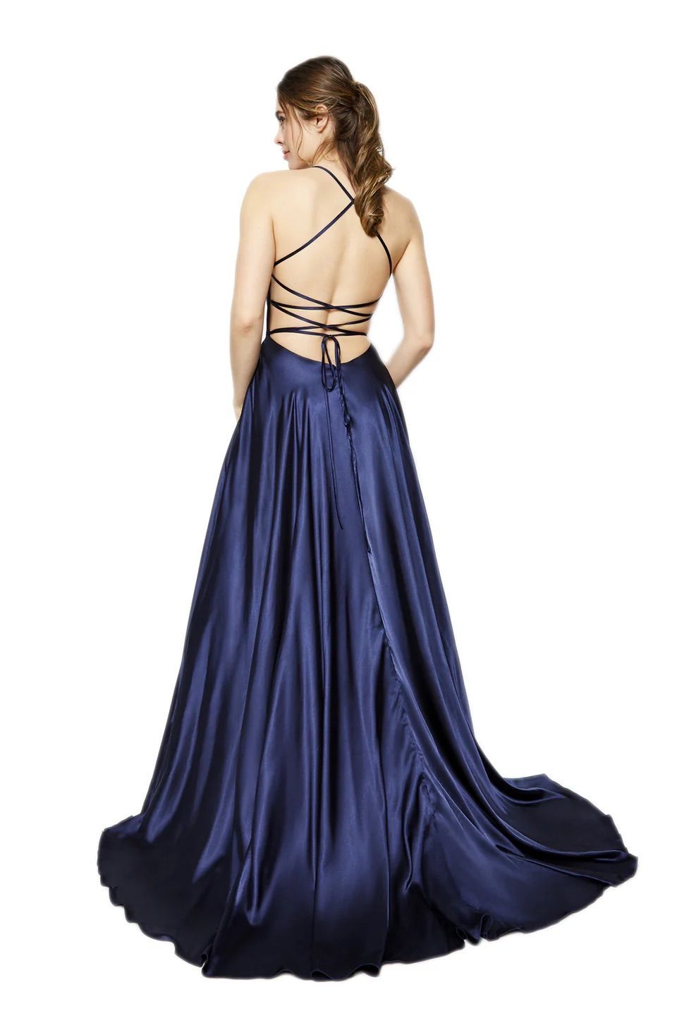 A woman is wearing a long blue dress with a lace up back.