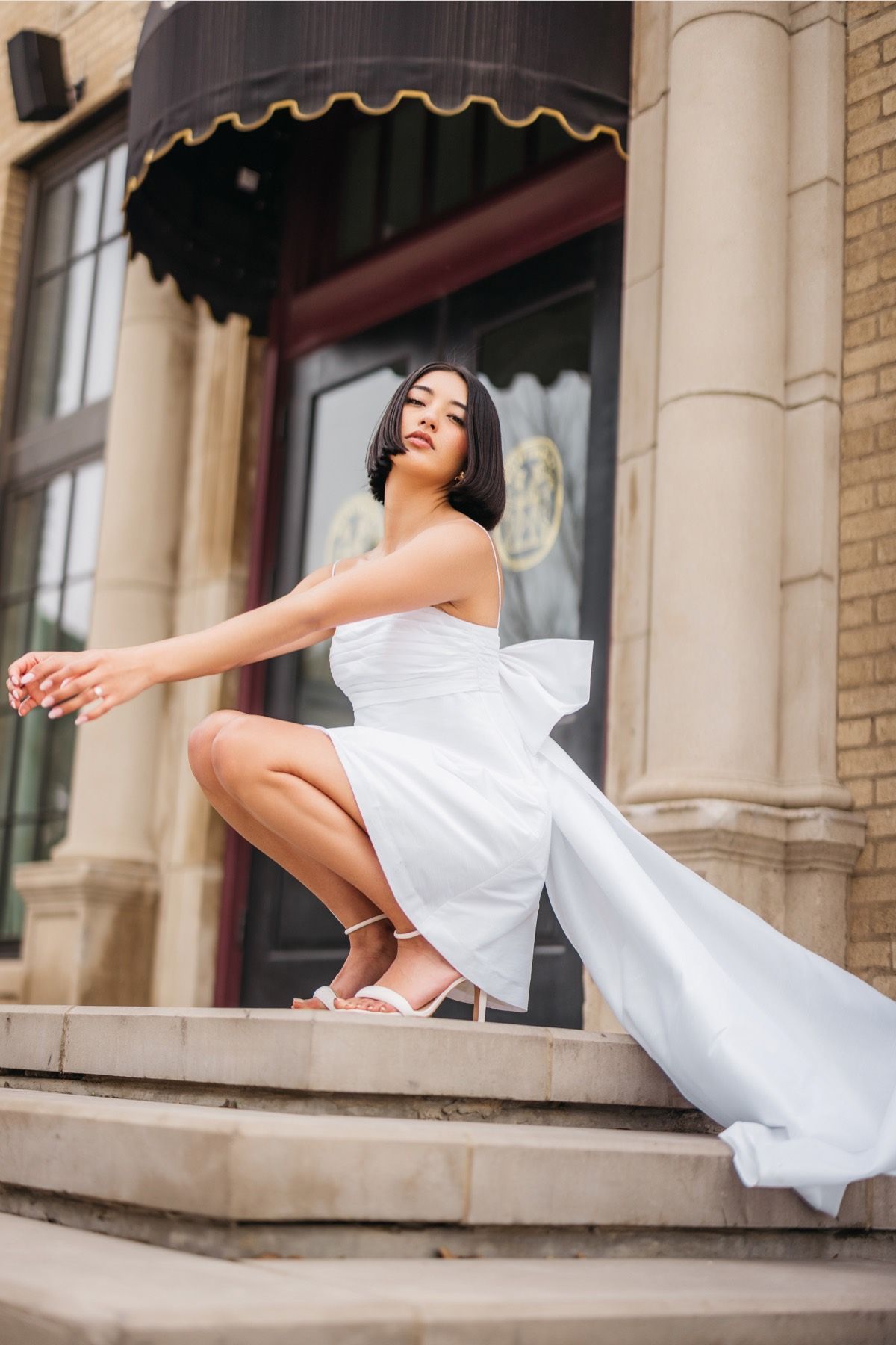 a woman in a little white dress