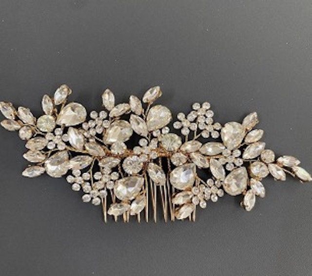 A hair comb with a lot of rhinestones on it