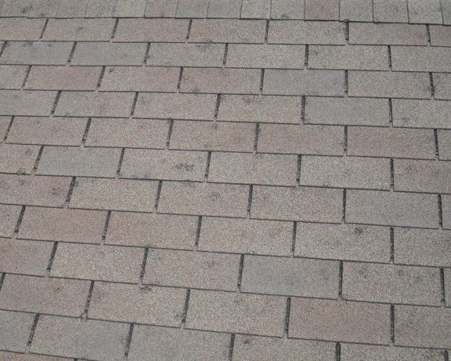 A close-up of a brick floor with a diagonal pattern