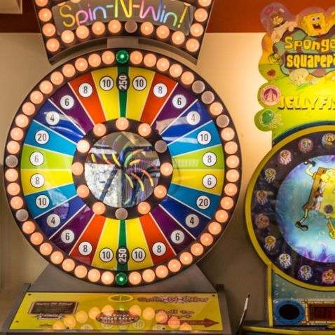 A colorful spinning wheel that says spin-n-win