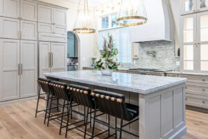 There is a large island in the middle of the kitchen.
