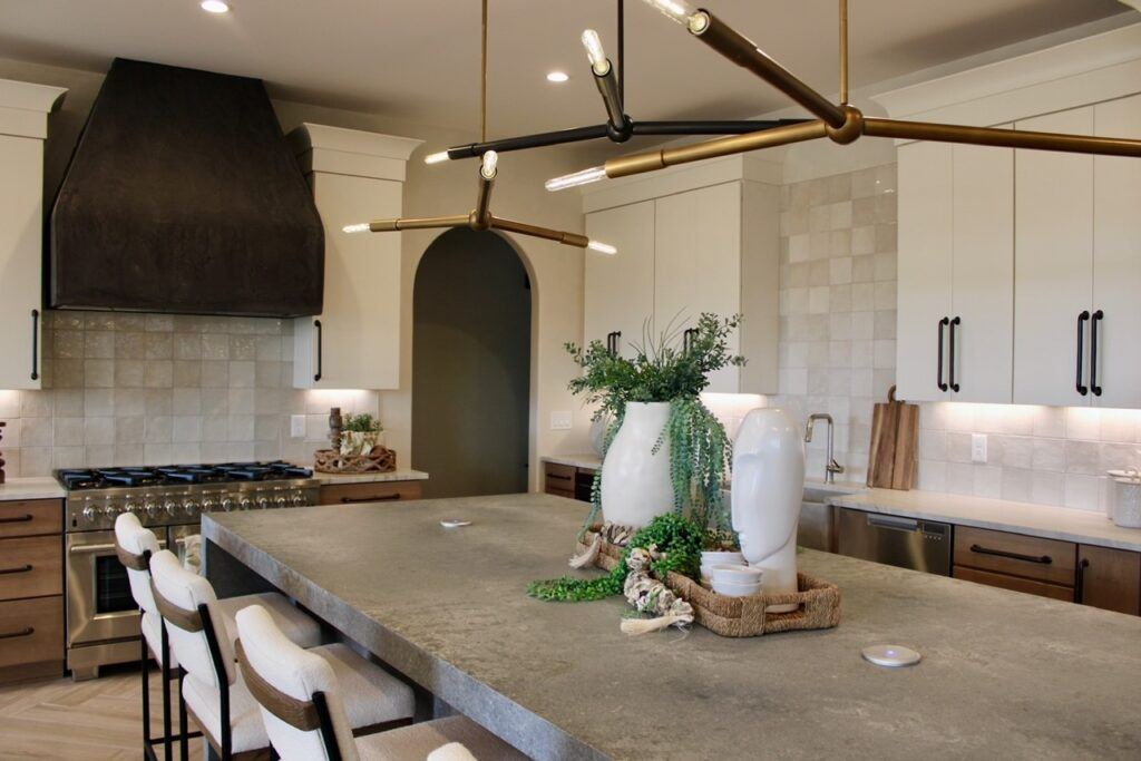 A kitchen with a large island and stools