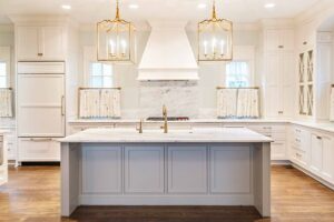 There is a large island in the middle of the kitchen.