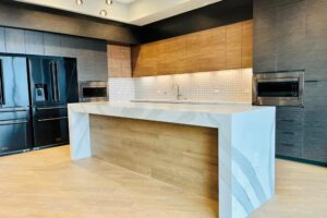 There is a large island in the middle of the kitchen.