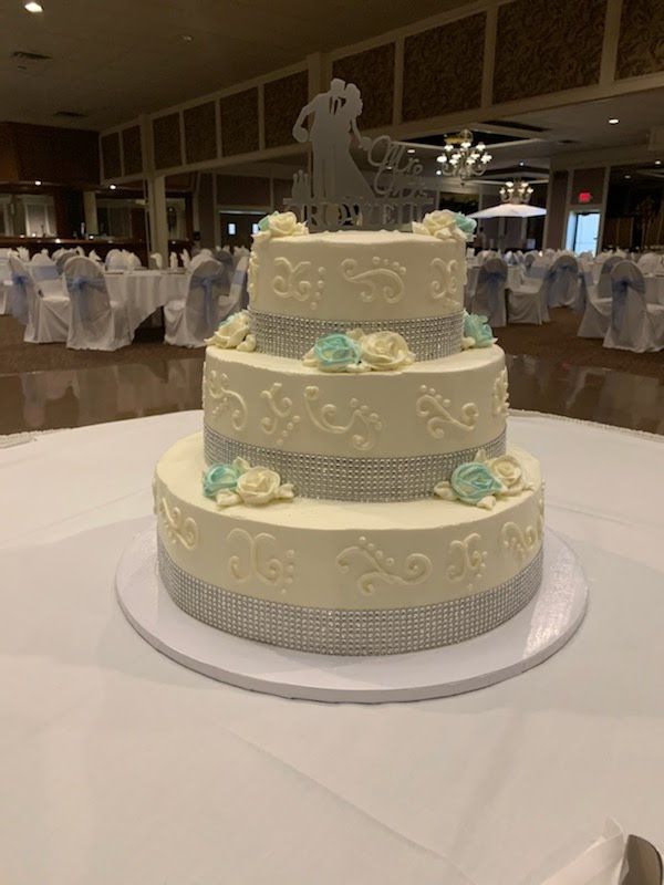 Teal white and pearls wedding cake