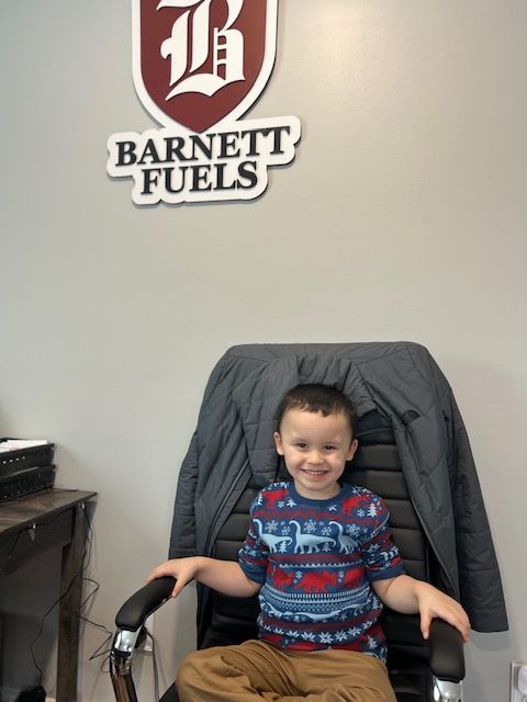 small boy sitting in chair