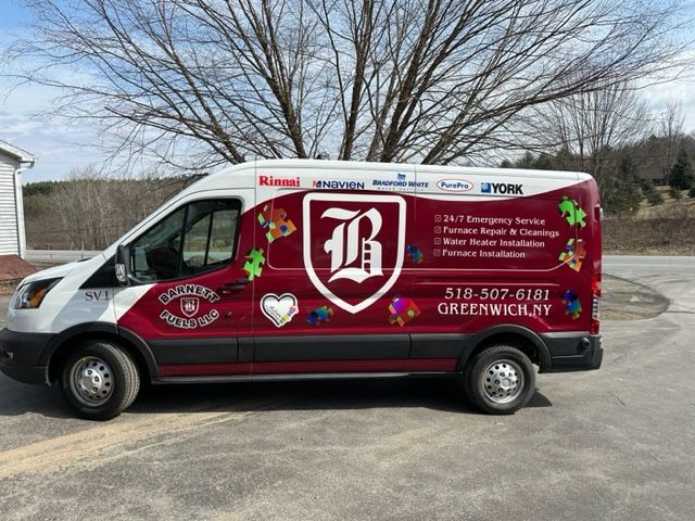 A red and white van is parked in a parking lot.