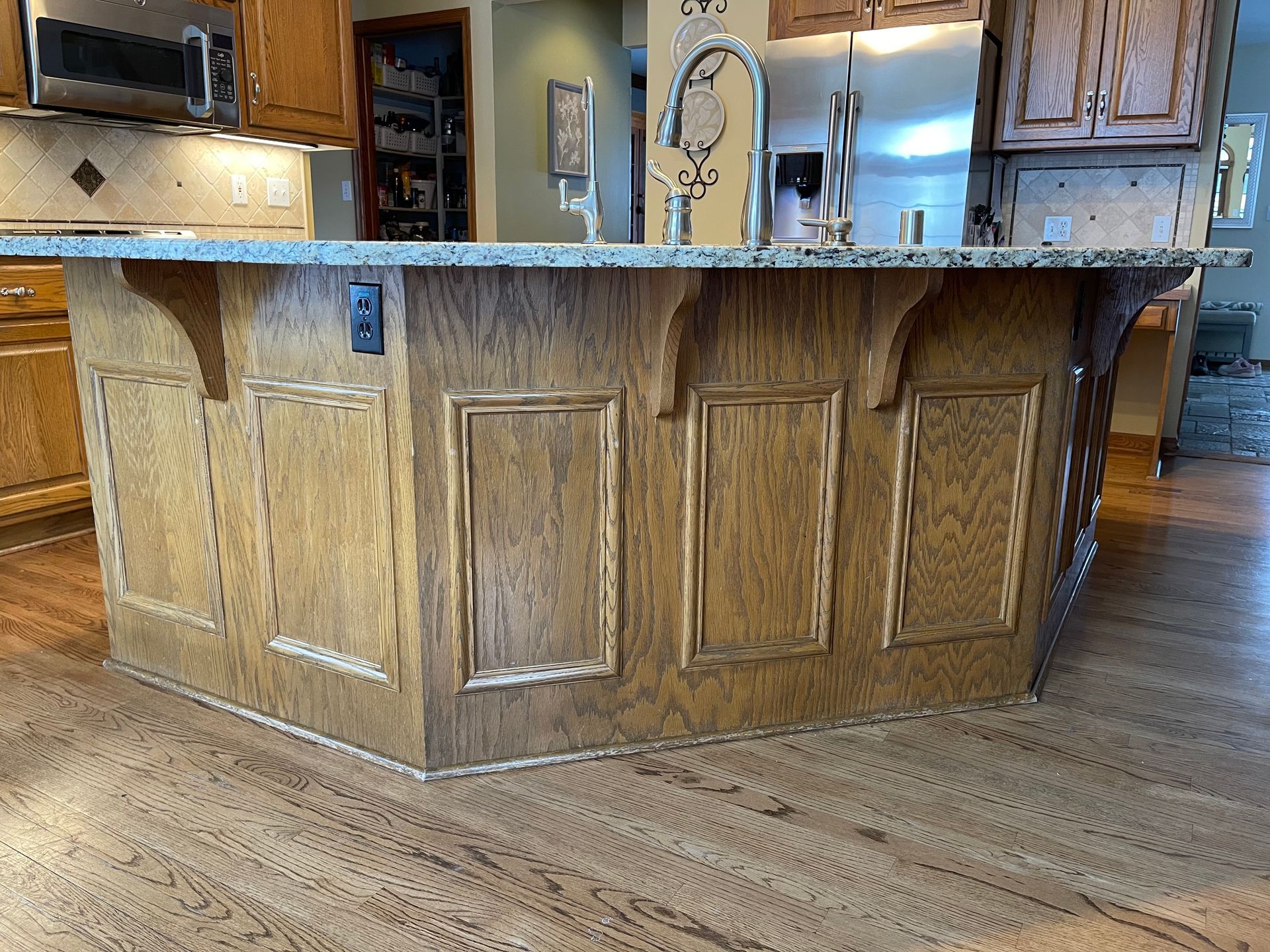 A kitchen with a large island in the middle of it - before