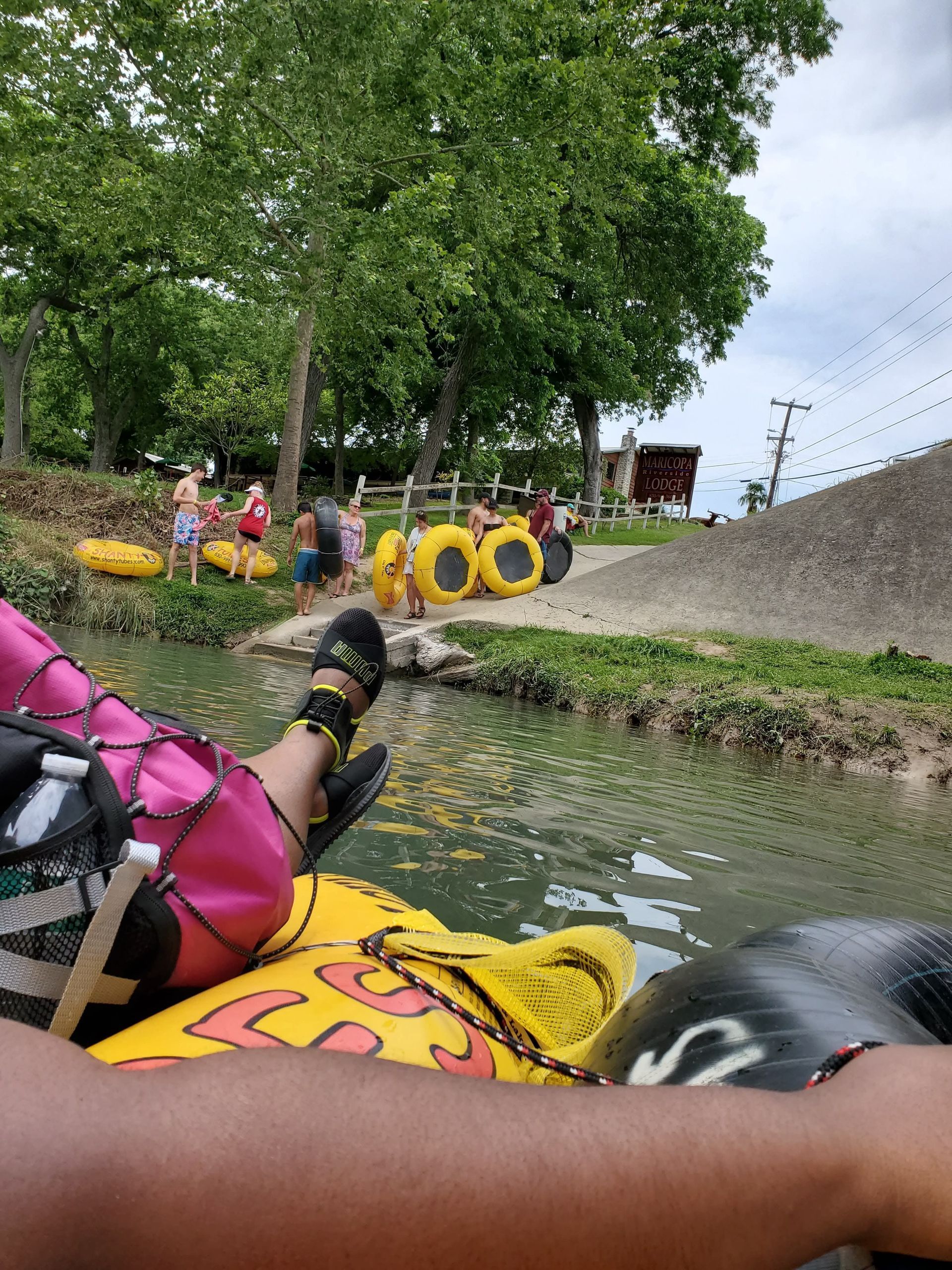 A person is laying on a tube in the water.