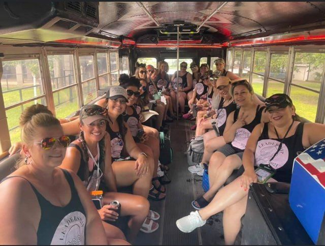 A group of women are sitting on a bus.