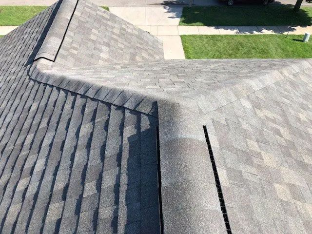 A close up of a roof with a gutter on it.