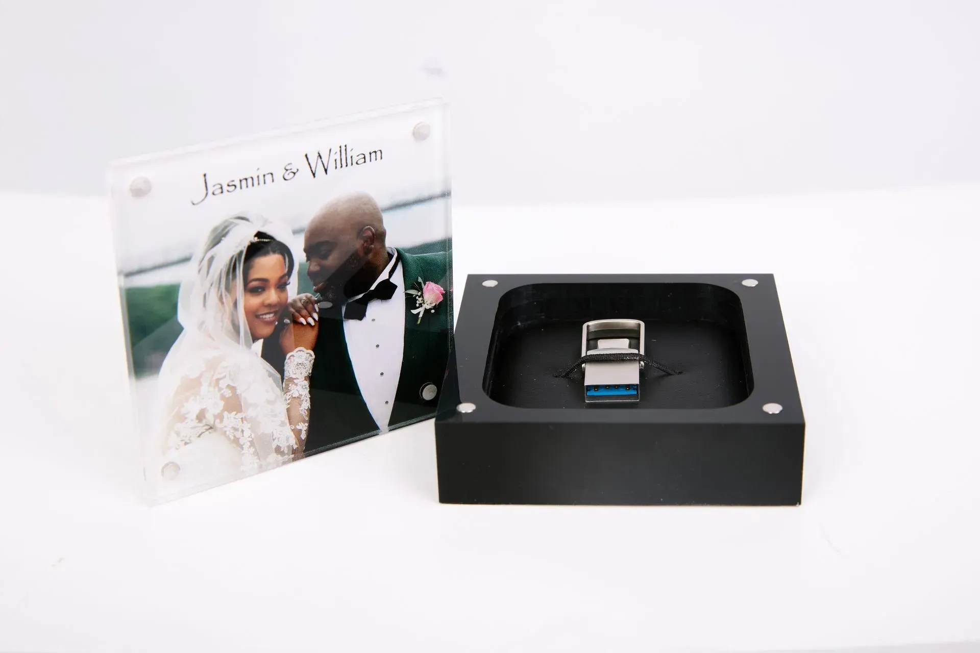 Wedding photo displayed with a flash drive inside a black box.