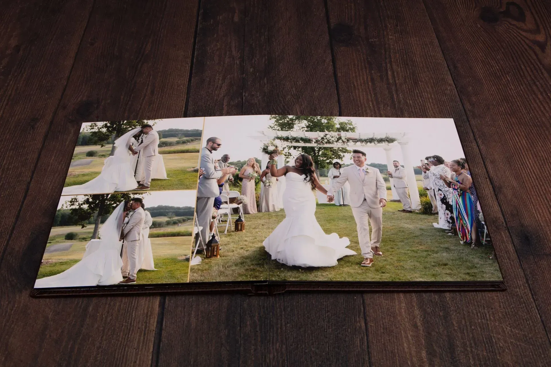 Wedding photo album open to photos of a couple, outdoor ceremony.