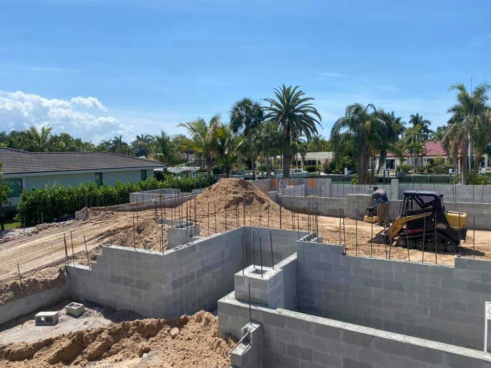 A construction site with a bulldozer in the middle of it.